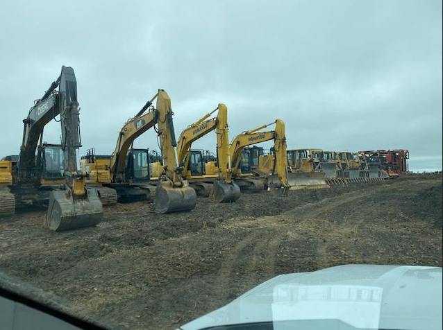 HGS Contracting heavy equipment lined up on a project site