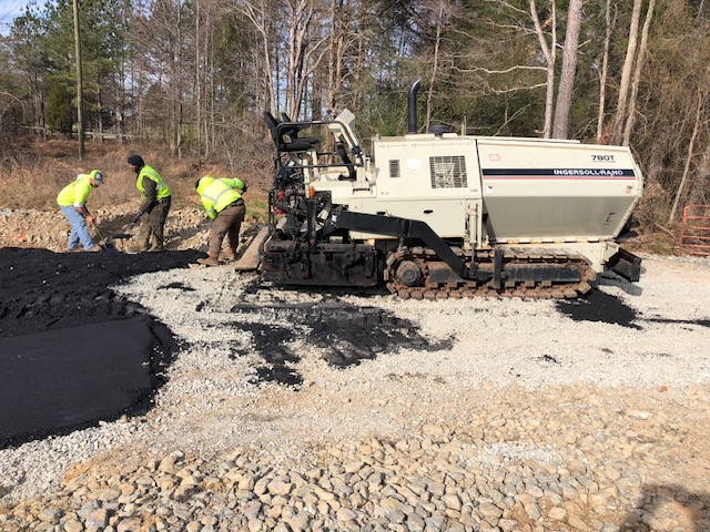 HGS Contracting crew paving asphalt with an Ingersoll-Rand paver